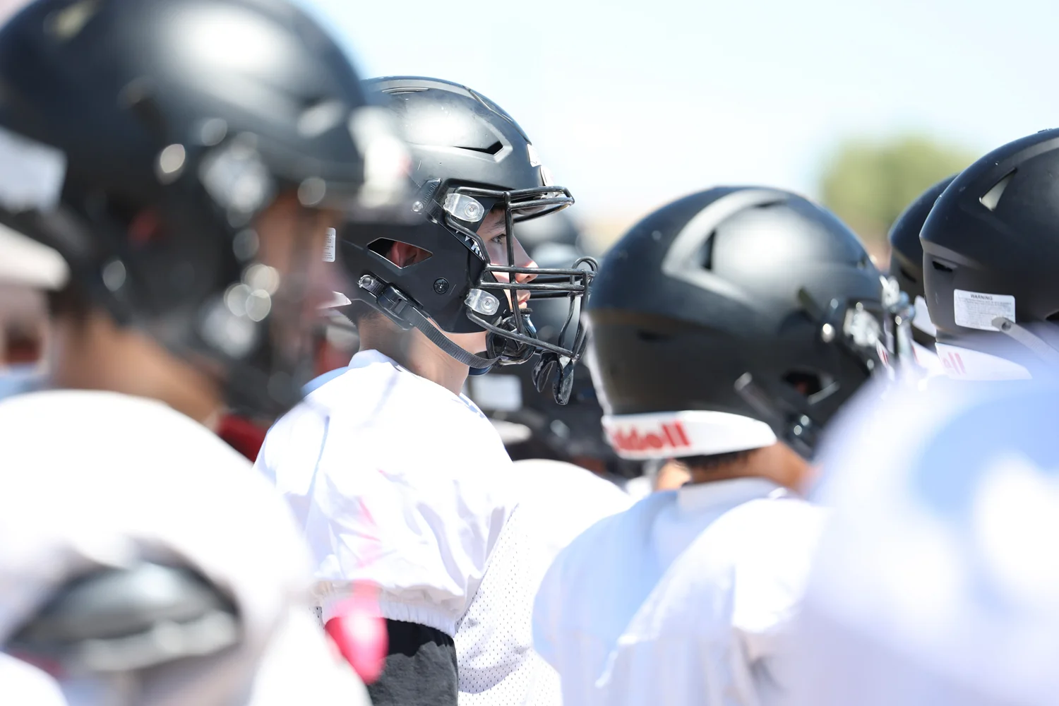 DRHS player looking on during the scrimmage